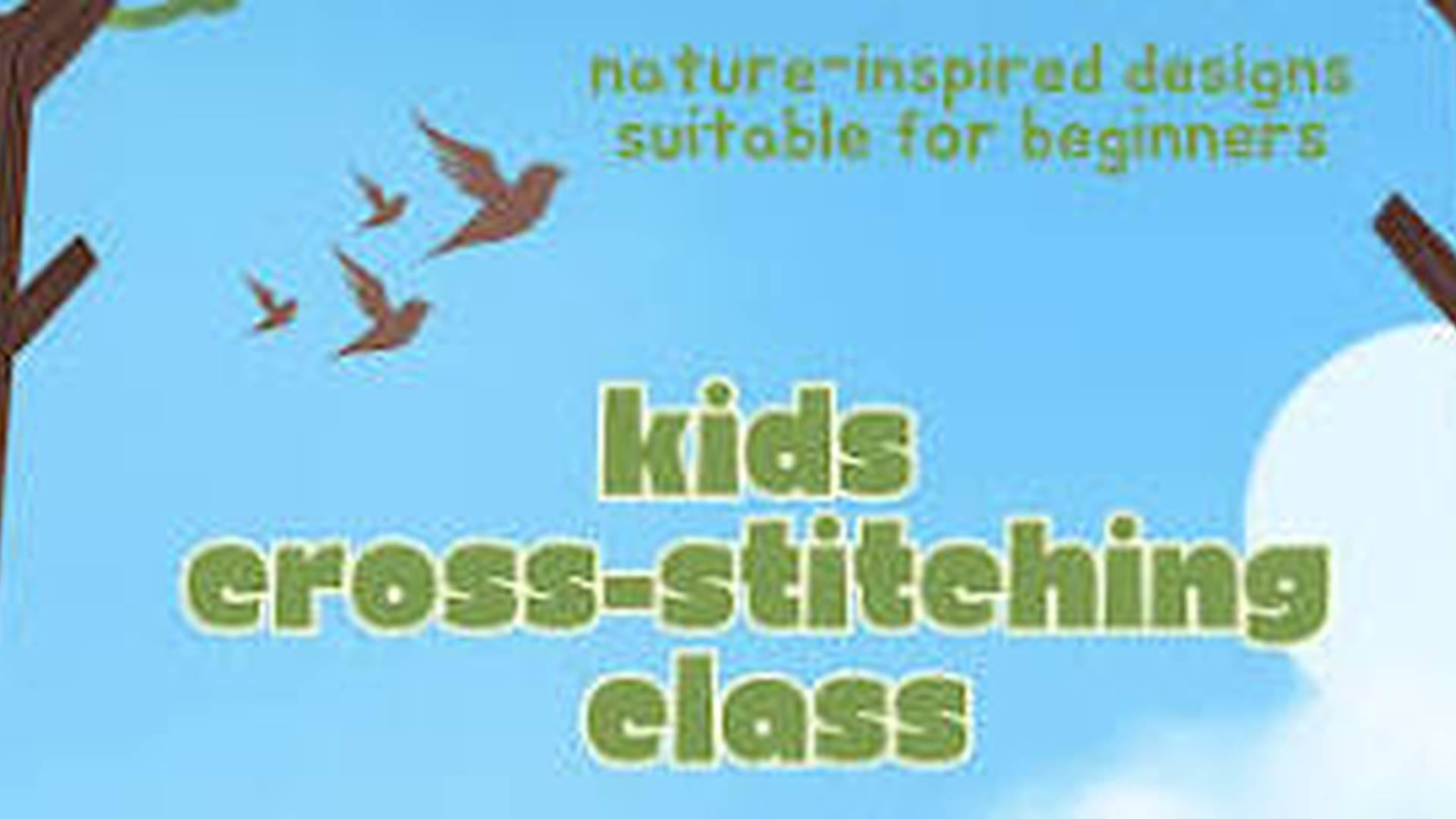 Kids cross-stitching class photo